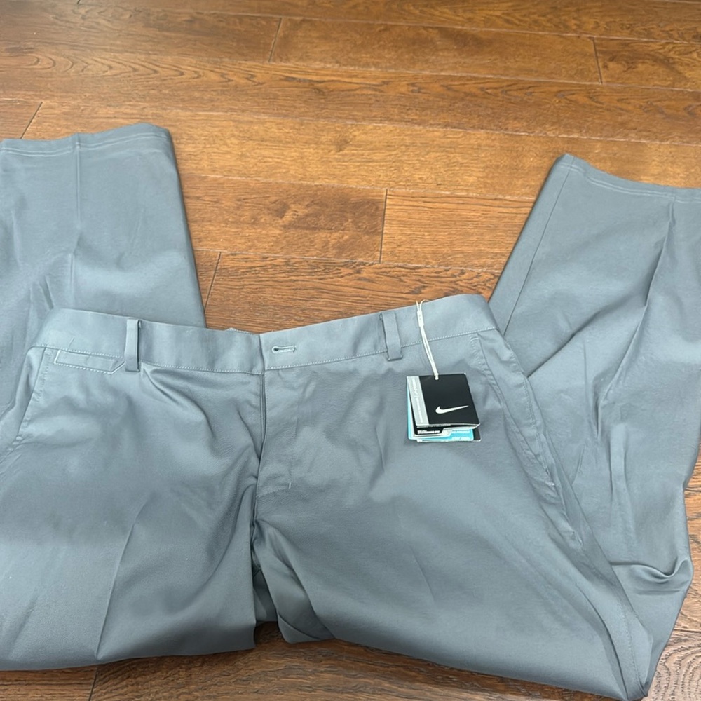 Nike. Men’s, gray/blue, standard fit, DRI FIT, golf pants. NWT.